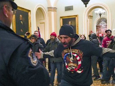 Trump-supporting rioters storming the US Capitol.