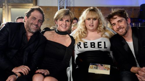 Australian Minister of Foreign Affairs Julie Bishop along with US director/producer Brett Ratner and Australian actors Rebel Wilson and Hugh Sheridan attend runway shows during Los Angeles Fashion Week at Union Station in Los Angeles in 2015. (AAP)