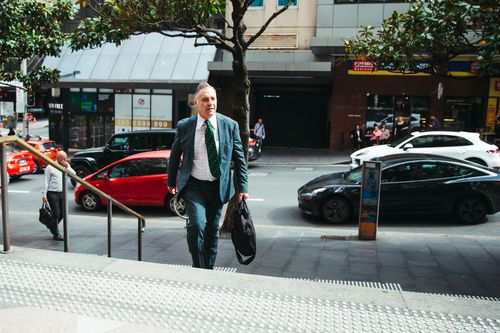 Former TV presenter Andrew OKeefe arrives at Downing Centre Local Court for his hearing on assault charges, Wednesday 1st of November 2023.  Photo: Dion Georgopoulos / The Sydney Morning Herald