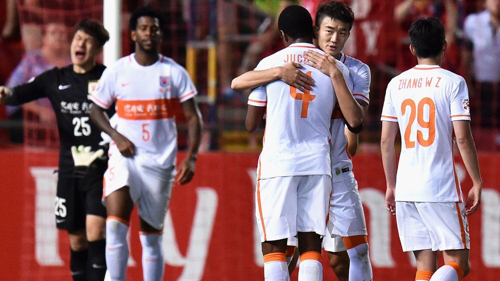 Shandong Luneng players celebrate their win. (Getty)