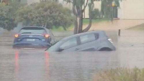 Perth's dry spell has ended in spectacular fashion after a major rain event smashed the city's northern suburbs with up to 100 millimetres falling in under an hour. Cars have ended up underwater after the extreme downpour caused flash flooding and trapped some drivers.