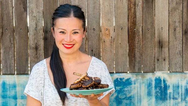 Poh Ling Yeow holding a plate of lamb for We Love Our Lamb. Image: Supplied