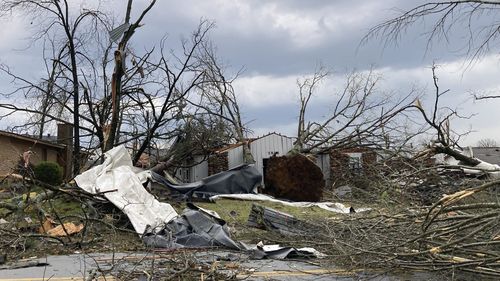 A homes is damaged and trees are down after a tornado swept through Little Rock, Ark., Friday, March 31, 2023.