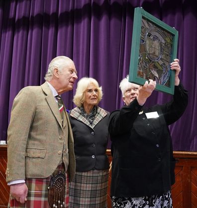 King Charles III and the Camilla, Queen Consort  view a piece of stain glass, commissioned by the Aberdeenshire Lieutenancy, a gift to the Queen during her Platinum Jubilee, which was presented by artist Shona McInnes to King Charles III and the Camilla, Queen Consort  during a reception to thank the community of Aberdeenshire 