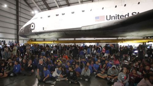 People follow the InSight landing from the California Science Center in Los Angeles.