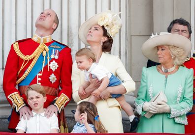 The young princess' blue bow had been moved to fasten her braids at the back of her head.