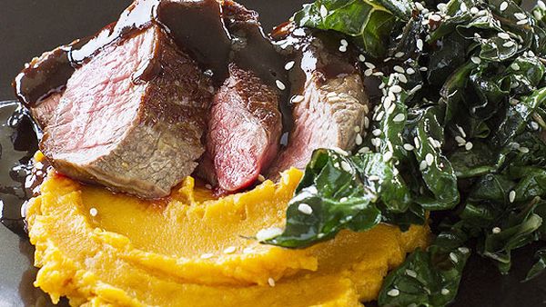 Beef fillet with orange miso sauce, sesame kale and sweet potato mash