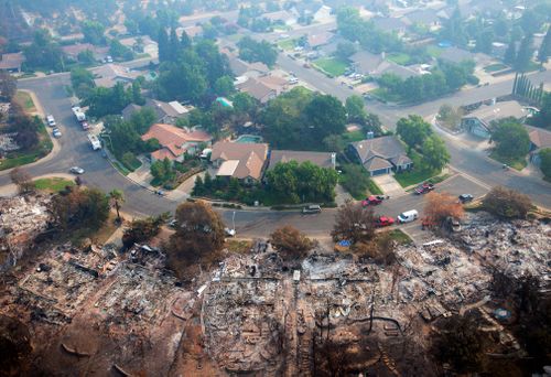 Homes destroyed by a wildfire are seen from an aerial view in the Keswick neighborhood of Redding.