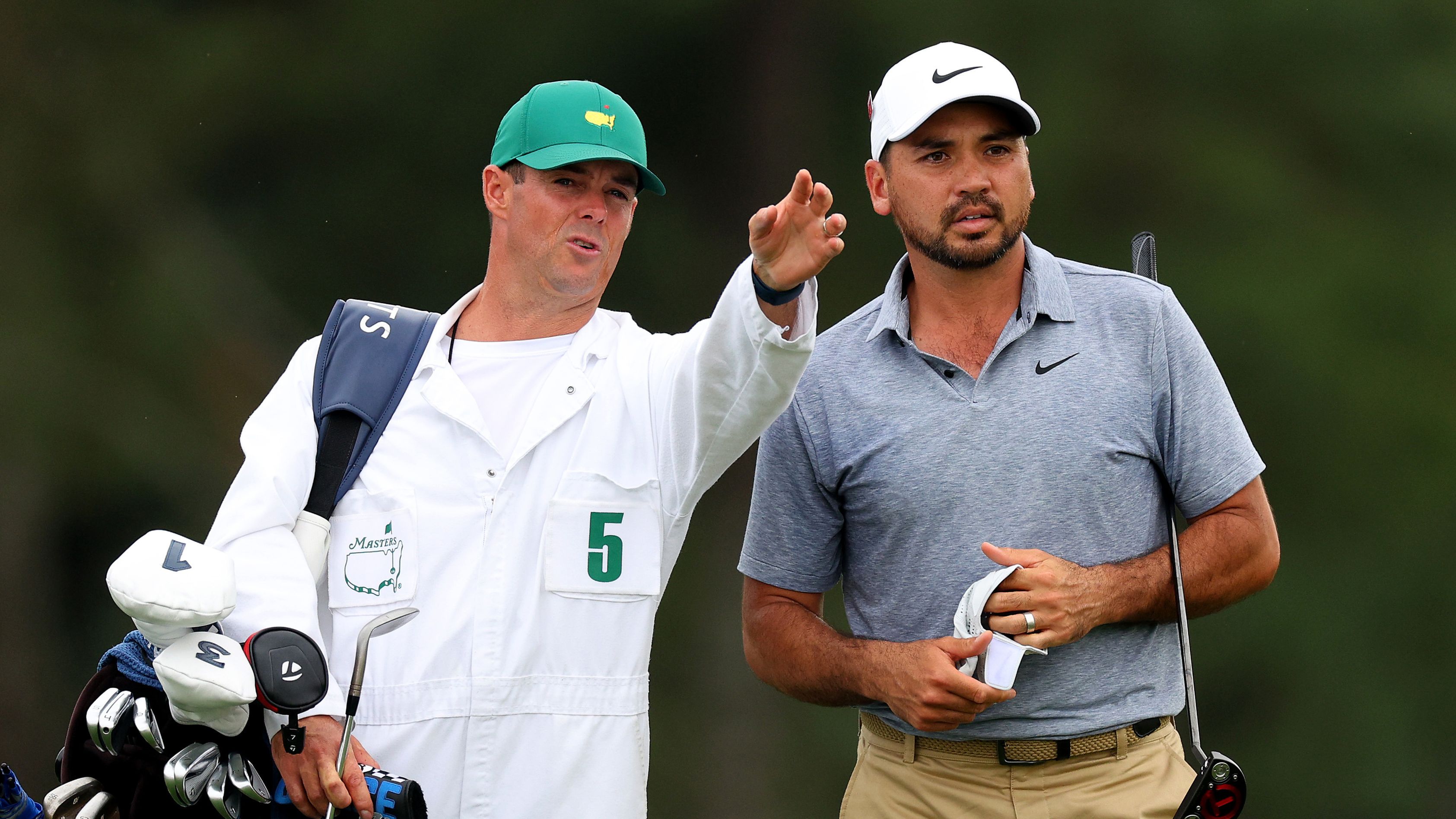 Jason Day of Australia talks with his caddie Luke Reardon on the 18th hole during the first round of the 2023 Masters Tournament at Augusta National Golf Club on April 06, 2023 in Augusta, Georgia. (Photo by Andrew Redington/Getty Images)