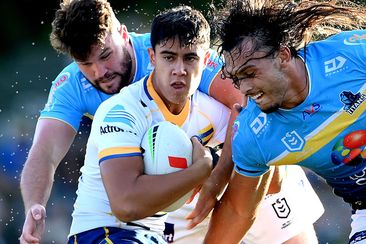Blaize Talagi of the Eels is tackled during a match against the Titans in the NRL&#x27;s 2024 Pre-Season Challenge.