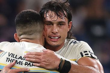 Tino Faasuamaleaui celebrates with David Fifita after the Titans defeated the Sydney Roosters.