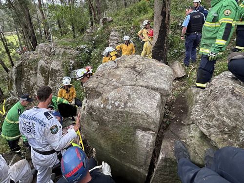 Woman stuck between two boulders in NSW