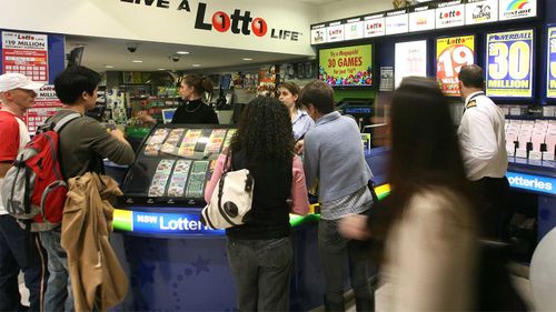 Punters queuing up at a newsagency to buy lottery tickets.