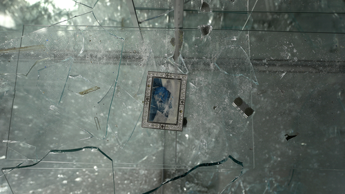 A single photograph is the only thing left in a broken glass case inside Gold & Diamonds store Tuesday, June 2, 2020, in St. Louis. The shop, like several other in downtown St. Louis, was burglarised and ransacked on Monday night. (AP Photo/Jeff Roberson)