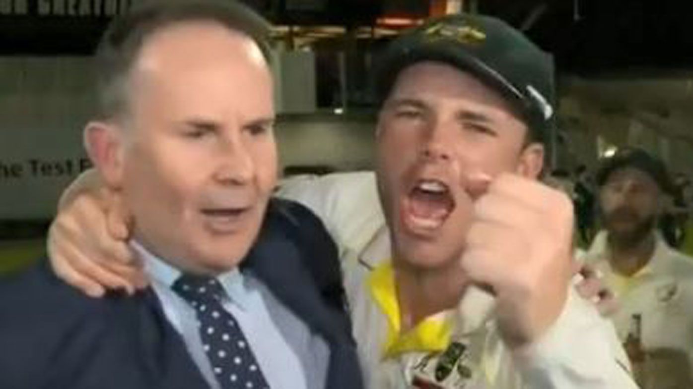 Nine's Tony Jones mobbed by Ashes-winning Australian players at Old Trafford