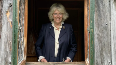 Camilla gives speech from the Queen's childhood playhouse.