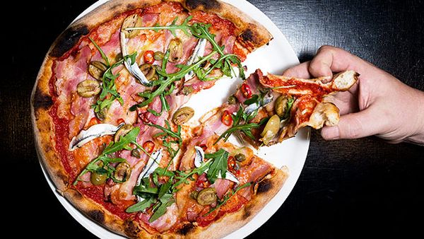 Pancetta pizza with white anchovies, chilli and green olives