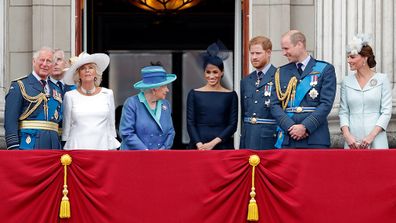 Prince Harry on balcony at official event.