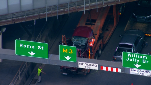 Truck trapped under Brisbane bridge
