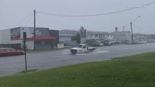 Reports woman swept away in Townsville floodwaters amid pouring rain