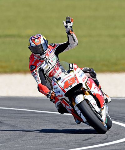 Aussie Jack Miller waves to the crowd on his warm-up lap.