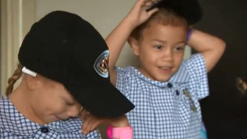 Two of the bubbly King triplets get ready for their big day. (9NEWS)