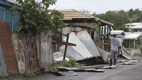 A man surveys the wreckage on his property after the passing of Hurricane Irma, in St. John's, Antigua and Barbuda. (AAP)
