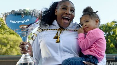 Serena Williams of the USA celebrates with daughter Alexis Olympia after winning the final match against Jessica Pegula