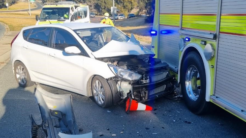 ACT Police said the fire truck was stationary at the time, with both its red and blue emergency lights and amber hazard lights operating.