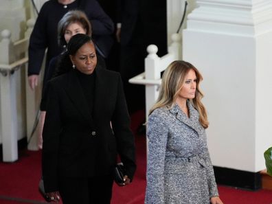 Former first ladies Melania Trump, Michelle Obama, Laura Bush and Hillary Clinton, arrive to attend a tribute service for former first lady Rosalynn Carter at Glenn Memorial Church, Tuesday, Nov. 28, 2023, in Atlanta. (AP Photo/Andrew Harnik)