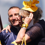 Damien Oliver is hugged by a representative of Alenquer before Race 7, the Lexus Melbourne Cup, during Melbourne Cup Day at Flemington Racecourse.