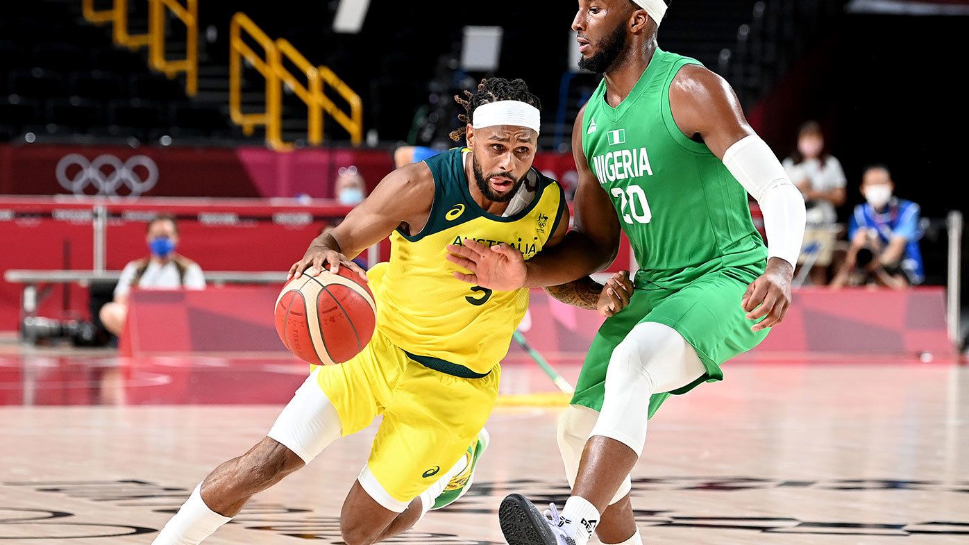 Patty Mills of Australia takes on the defence of Josh Okogie of Nigeria during the preliminary rounds of the Men&#x27;s Basketball match between Australia and Nigeria on day two of the Tokyo 2020 Olympic Games at Saitama Super Arena on July 25, 2021 in Saitama, Japan. (Photo by Bradley Kanaris/Getty Images)