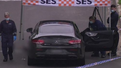 A Mercedes AMG was seen near the man's body.