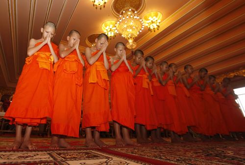 In Thailand, Buddhist ordination is an act of gratitude - any male can enter brief Monkhood while boys can serve as novices. Picture: AAP