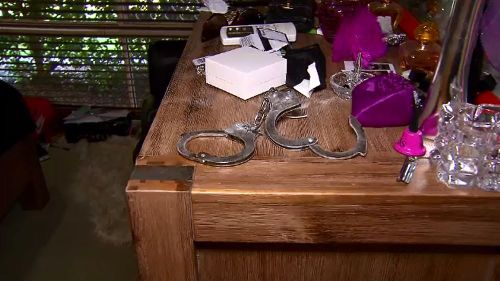The robbers restrained Justin Miles and his step-son with handcuffs they found in the bedroom. (Image: 9NEWS)