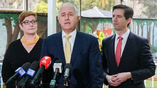  Malcolm Turnbull (centre) speaks to the media as Minister for Defence Marise Payne (left) and Minister for Education Simon Birmingham look on during a visit to the Mud Puddles Cottage Child Care Centre in Sydney. (AAP)