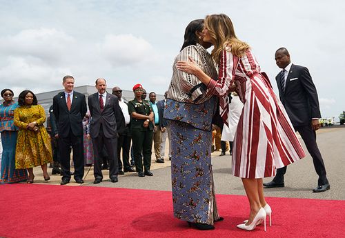 First lady Melania Trump is greeted by Ghana's first lady Rebecca Akufo-Addo as she arrives at Kotoka International Airport in Accra, Ghana.