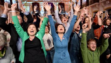 Supporters of Norbert Hofer's political opponent react to the first results after Austria's Presidential elections in Vienna on December 4, 2016. (AFP)