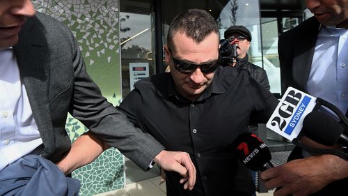 Anthony Koletti (centre) the husband of Melissa Caddick leaves Lidcombe coroners court, NSW.  The coroner described Koletti as an unreliable and unimpressive witness. May 25, 2023. Photo: Kate Geraghty