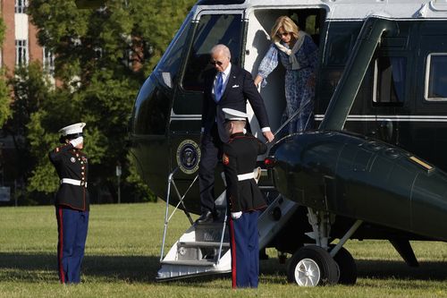 President Joe Biden and first lady Jill Biden arrive on Marine One at Fort Lesley 