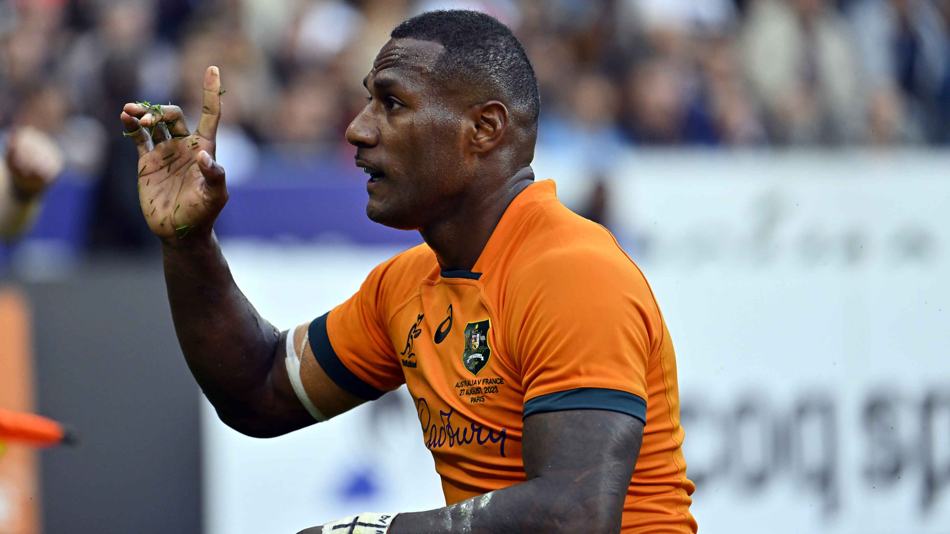 Suliasi Vunivalu of Australia reacts after scoring a try.