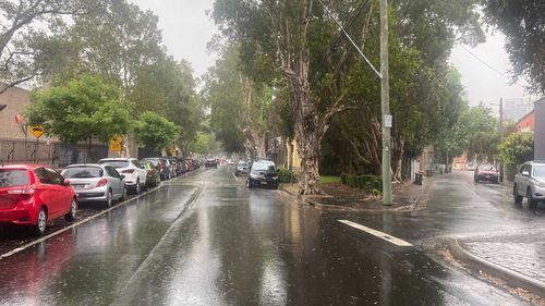 Heavy rain has started over Sydney with a rumble of thunder.
