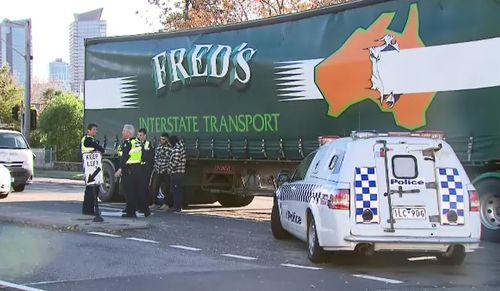 The truck driver stopped on Inglis Street and was then blocked in by three vans. Picture: 9NEWS