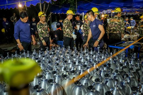 Scuba tanks are delivered to the site for the dive teams involved in the rescue coordination in Chiang Rai. (Getty)