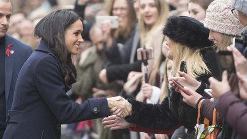 Ms Markle went off on our own and greeted the crowd. (AAP)