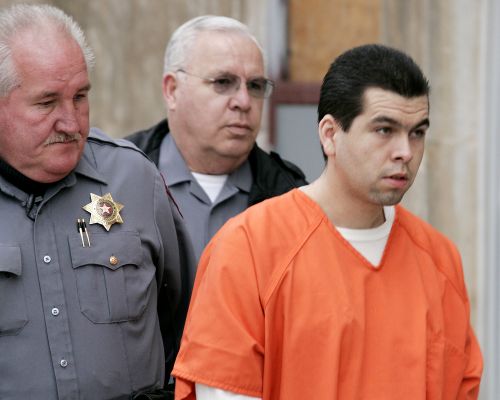Anthony Sanchez, right, is escorted into a Cleveland County courtroom for a preliminary hearing in Norman, Okla., Feb. 23, 2005
