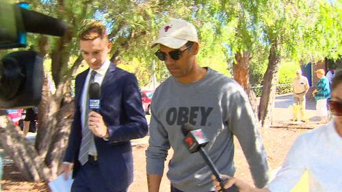 Ex-Fremantle Dockers AFL player Shane Yarran shoved a cameraman outside a Perth court today before facing an attempted burglary charge. Picture: 9NEWS.