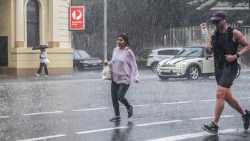 Sudden downpour catches people out in Paddington, Sydney