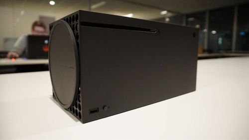 The Xbox Series X can be placed on its side as well as a tower, but will likely be too big for many entertainment systems. 