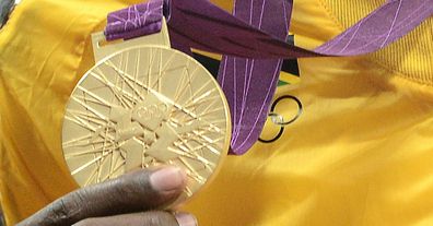 Olympic gold medal for 100m dash (Getty)